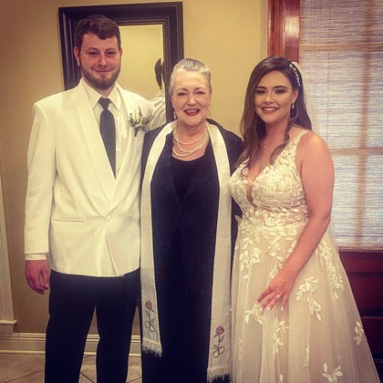 Sarah with a couple in a private suite